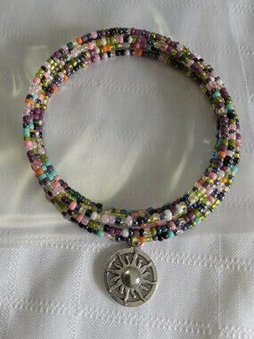 Handmade memory wire bracelet with beads and pendant